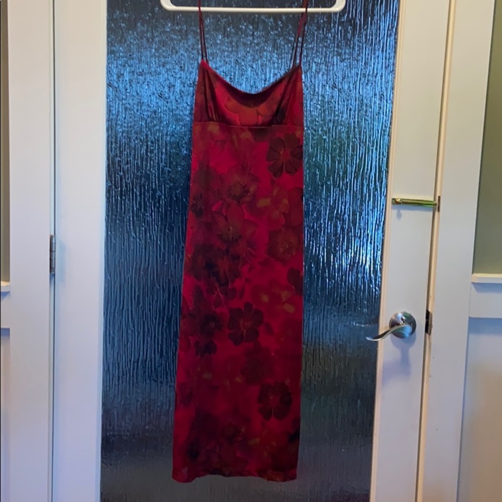 Spaghetti strap shin length dress. Tie back.